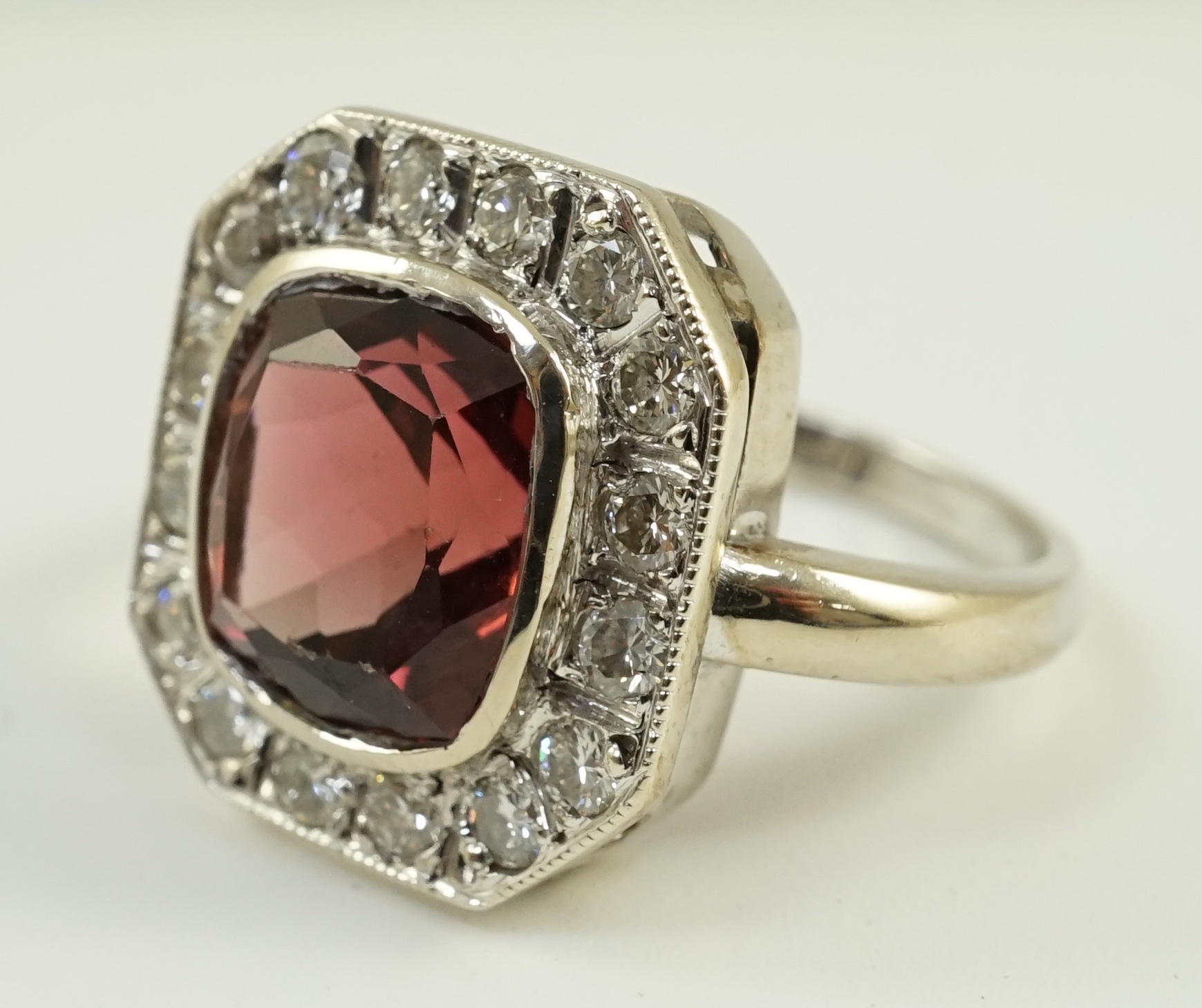 An 18ct white gold, tourmaline and diamond set octagonal dress ring